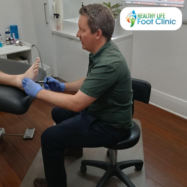 Adelaide Podiatrist, Joel Urban, Treating a Patient Using Mobilisation