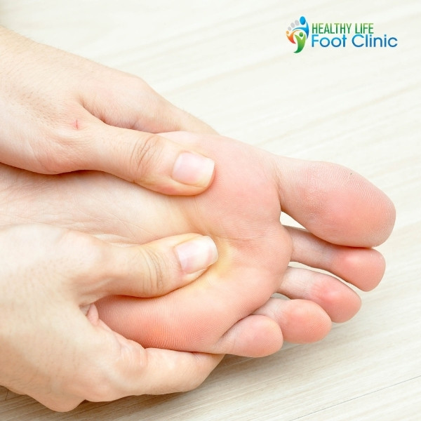 Person Suffering From Pain Under the Ball of the Foot
